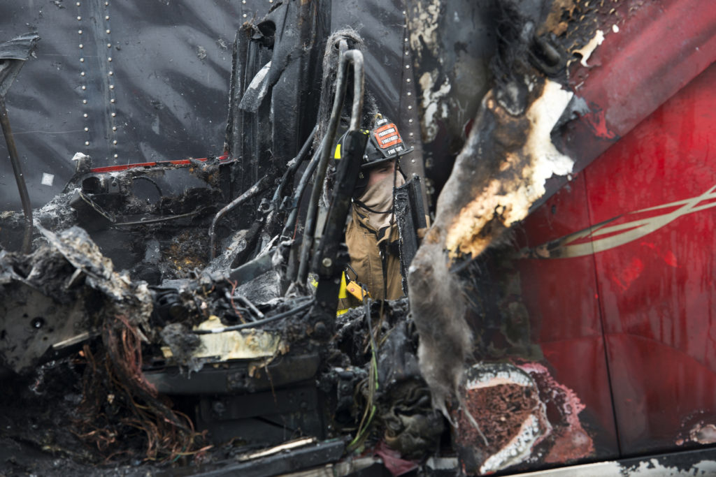 A tractor trailer went up in flames in a Kellogg Street parking lot just off Route 440 in Jersey City, on Wednesday, March 4, 2015. Reena Rose Sibayan | The Jersey Journal