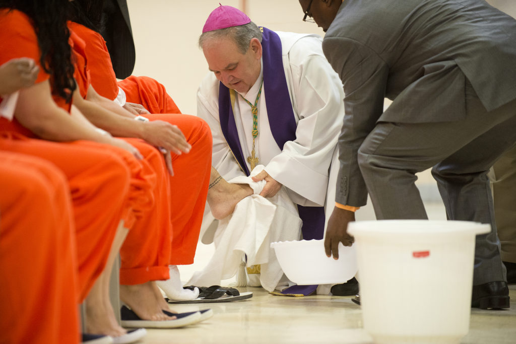 The Most Rev. Bernard A. Hebda, coadjutor archbishop of Newark, performs the religious rite, Washing of the Feet, on prisoners during the Inmates Lenten Retreat at Hudson County Correctional Center in Kearny on Tuesday, March 31, 2015. Reena Rose Sibayan | The Jersey Journal
