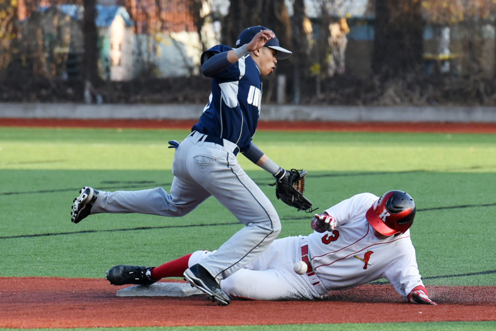 Kearny's Mike Hyde is safe at second base as Union City's Jonathan Rosario fails to make the catch during the baseball game on Friday, April 17, 2015, in Kearny. Reena Rose Sibayan | The Jesey Journal
