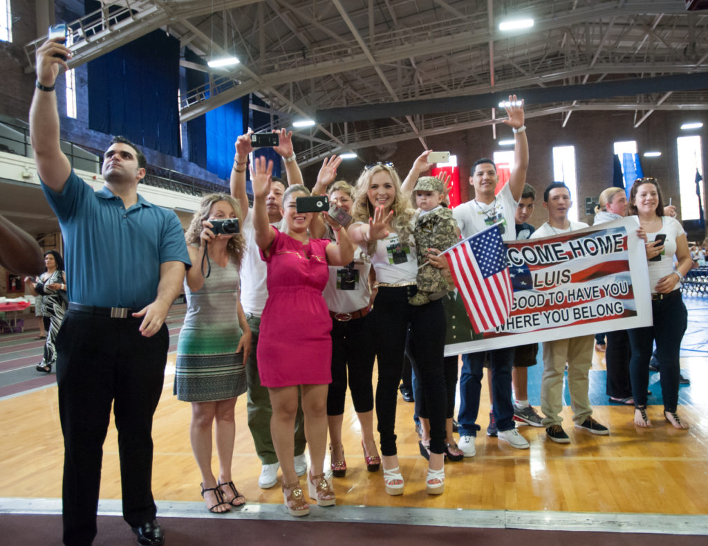 Families and dignitaries welcome home 160 soldiers of the New Jersey Army National Guard's Alpha Company, 2-113th Infantry Battalion, after a nine-month deployment in the Persian Gulf, with a ceremony held at the Jersey City armory on Thursday, June 25, 2015. Reena Rose Sibayan | The Jersey Journal