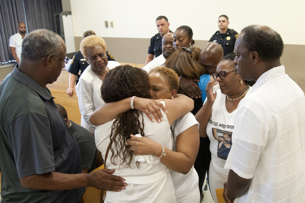 After the sentencing, grieving family members and friends of the vehicular homicide victim, Ron Hill II, and convicted killer, Luis E. Garcia, crossed the courtroom aisle and hugged and cried in each other's arms, offering each other condolences, on Friday, June 26, 2015. Reena Rose Sibayan | The Jersey Journal