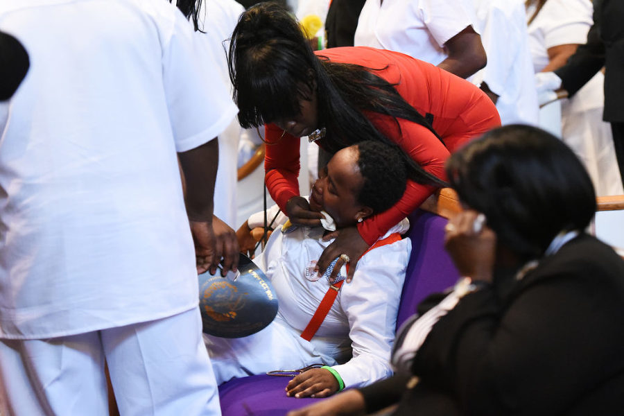 Dawn and Ronald Witherspoon Sr. close the lid on the casket of their son, Ronald Witherspoon Jr. at the conclusion of his funeral at Mt. Olive Baptist Church in Jersey City on Tuesday, Aug. 4, 2015. The Lincoln High School student was shot in the head in the early morning hours of July 22 on Belmont Avenue. Reena Rose Sibayan | The Jersey Journal