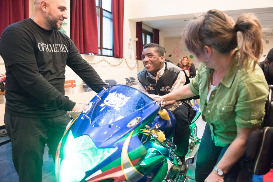 Students at A. Harry Moore in Jersey City, a school for those with physical and learning disabilities, received toys, hats and gloves from Santa Claus, and got to sit on motorcycles when members of the Wicked Riders motorcycle club paid them a visit on Tuesday, Dec. 22, 2015, for their annual holiday toy giveaway. Reena Rose Sibayan | The Jersey Journal