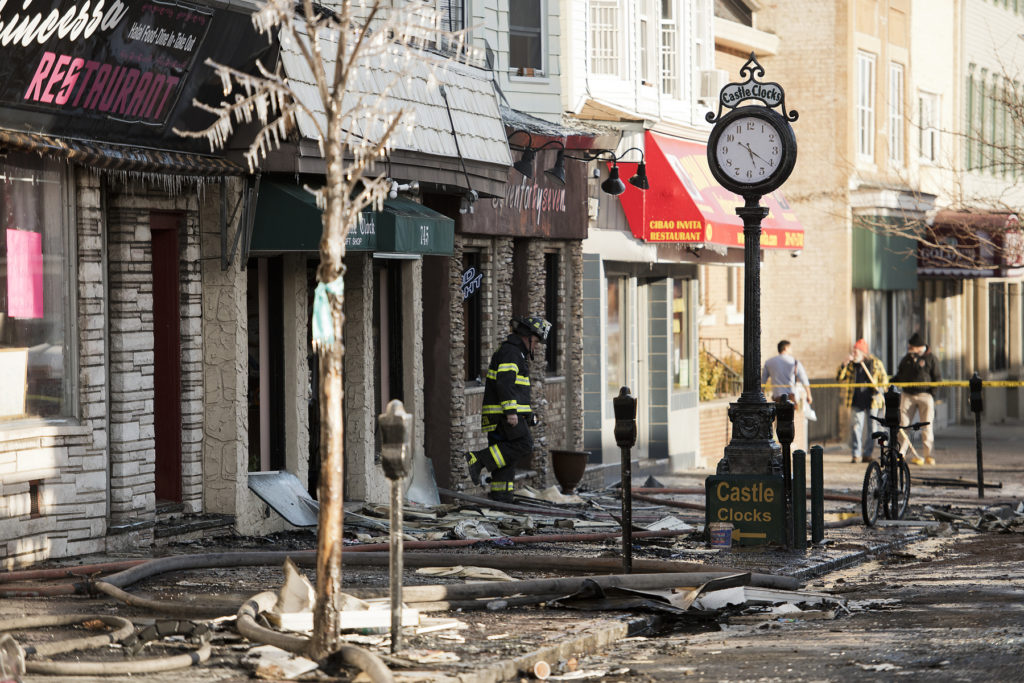 Aftermath on Wednesday, Jan. 20, 2016, of a five-alarm fire which ripped through three attached buildings from 743 to 747 Broadway, near 33rd Street, in Bayonne, on Tuesday afternoon. Reena Rose Sibayan | The Jersey Journal