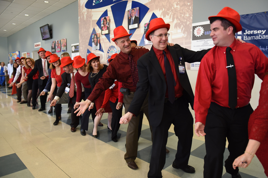 Members of the administration staff perform in Jersey City Medical Center-Barnabas Health's annual Happy Hearts Dance Competition, where departments compete against each other to raise money and awareness for the American Heart Association (AHA) on Thursday, Feb. 18, 2016. Reena Rose Sibayan | The Jersey Journal