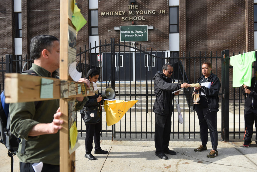 Various congregations, comprising Episcopalians, Lutherans, Methodists, Protestants and Roman Catholics hold the 'Walk With Jesus' Stations of the Cross procession, visiting 14 sites of violent incidents in Jersey City over the last year, on Good Friday, March 25, 2016. Reena Rose Sibayan | The Jersey Journal