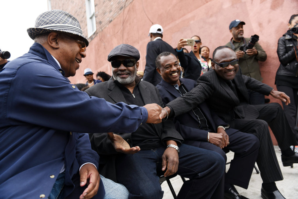 A section of Maple Street between Pacific Avenue and Whiton Street in Jersey City is renamed "Kool & the Gang Way" during a ceremony on Friday, April 29, 2016. From left are Dennis "DT" Thomas, Ronald Bell, Robert "Kool" Bell and George Brown. Reena Rose Sibayan | The Jersey Journal