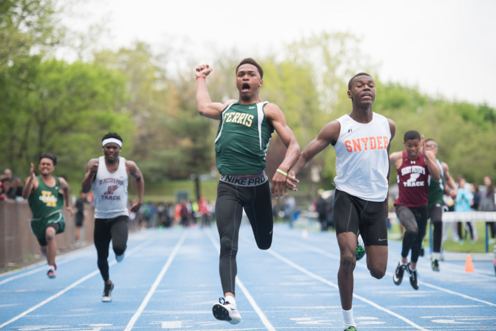 Ferris' Ivan Daniels, left, wins in the freshman boys 100-meter dash, followed closely by Snyder's Jawuan James, during the 2016 Jersey City Outdoor Track & Field Championship at Stephen R. Gregg Park in Bayonne on Tuesday, May 3, 2016. Reena Rose Sibayan | The Jersey Journal