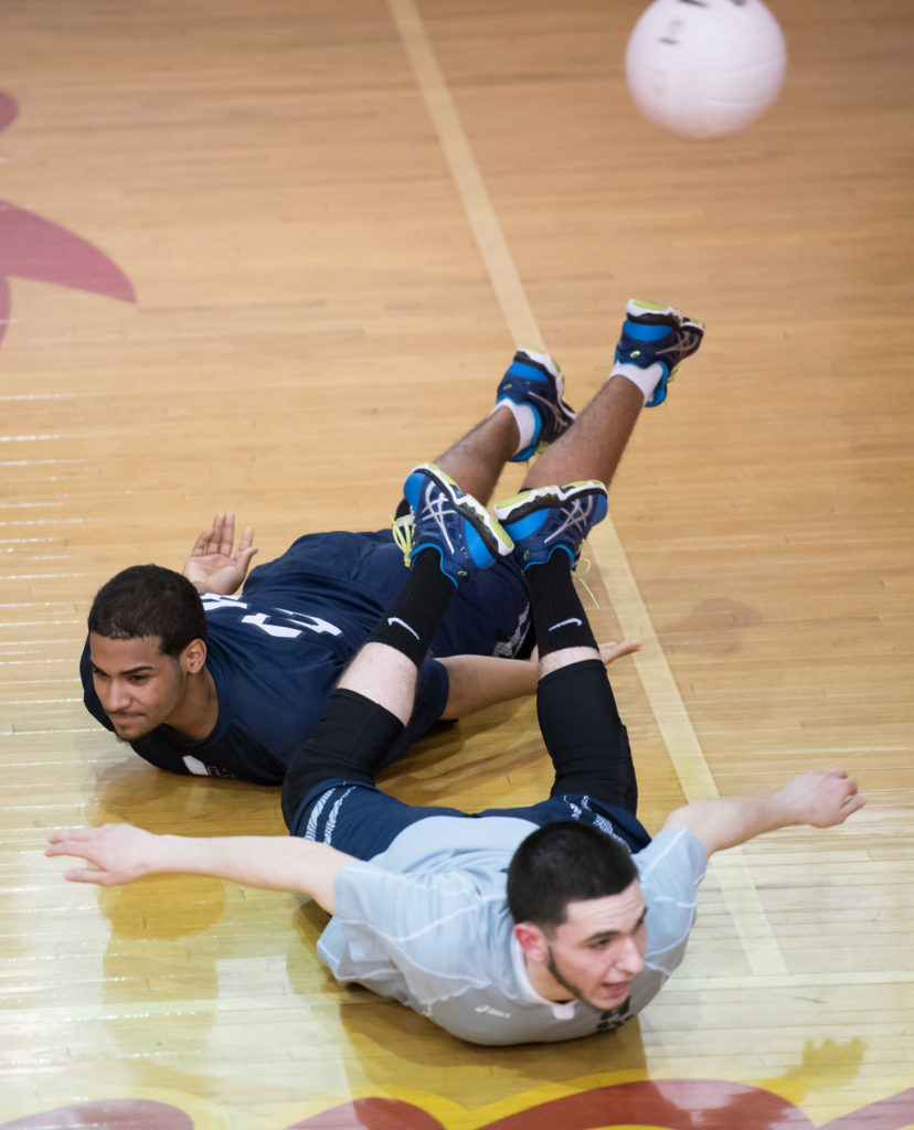 Union City's Armando Aviles (left) and Matthew Gerges dive for the ball during the boys volleyball Hudson County Tournament quarterfinals against North Bergen in North Bergen on Wednesday, May 18, 2016. North Bergen won, 20-25, 25-14, 25-20. Reena Rose Sibayan | The Jersey Journal