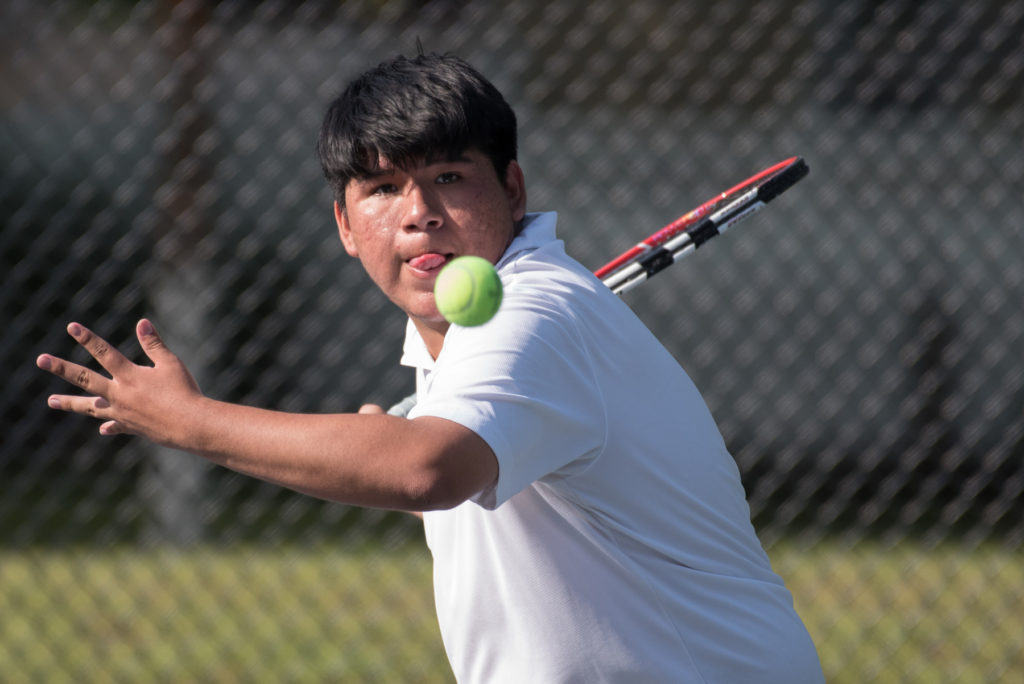 Harrison's David dela Cruz competes in the third singles match against Kearny's Adrian Velasquez during the Hudson County team tennis tournament quarterfinals at West Hudson Park in Kearny on Friday, May 20, 2016. Reena Rose Sibayan | The Jersey Journal