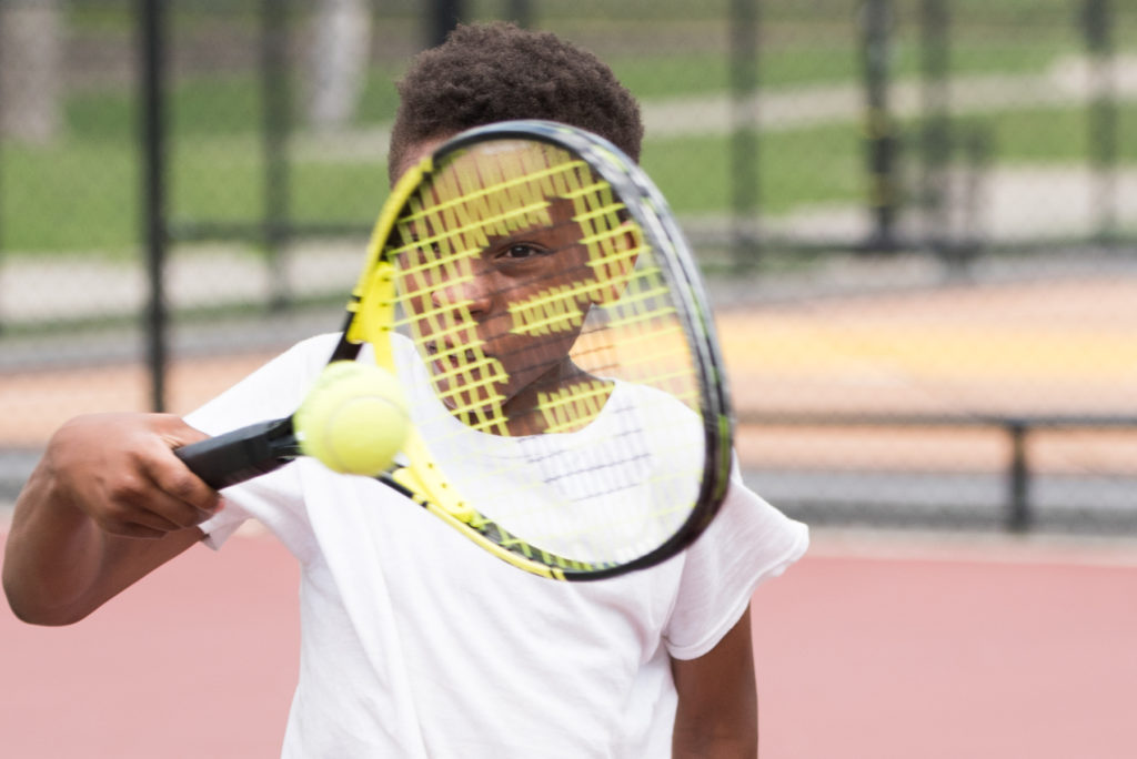 Kids take part in the Urban League's Summer Tennis Program at Bayside Park in Jersey City on Friday, Aug. 5, 2016. Reena Rose Sibayan/The Jersey Journal