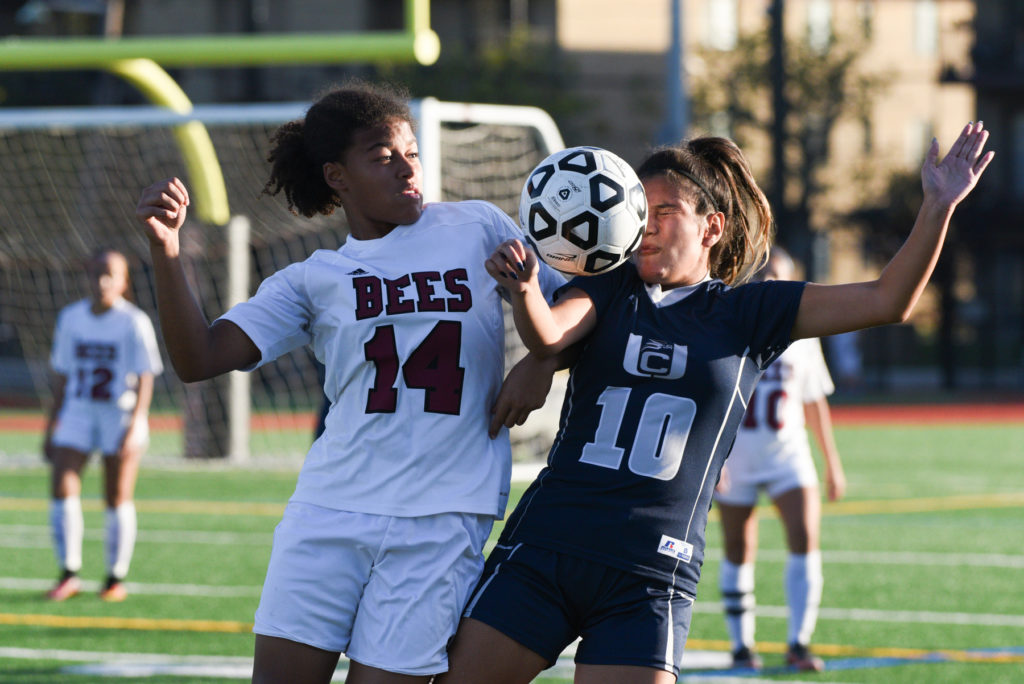 Bayonne's Niaimani Marshall (14) and Union City's Antonella Fernandini (10) goes up for a header during the first half of the Hudson County Tournament quarterfinals against Union City at Ahern Veterans Stadium on Wednesday, Oct. 12, 2016. Reena Rose Sibayan | The Jersey Journal