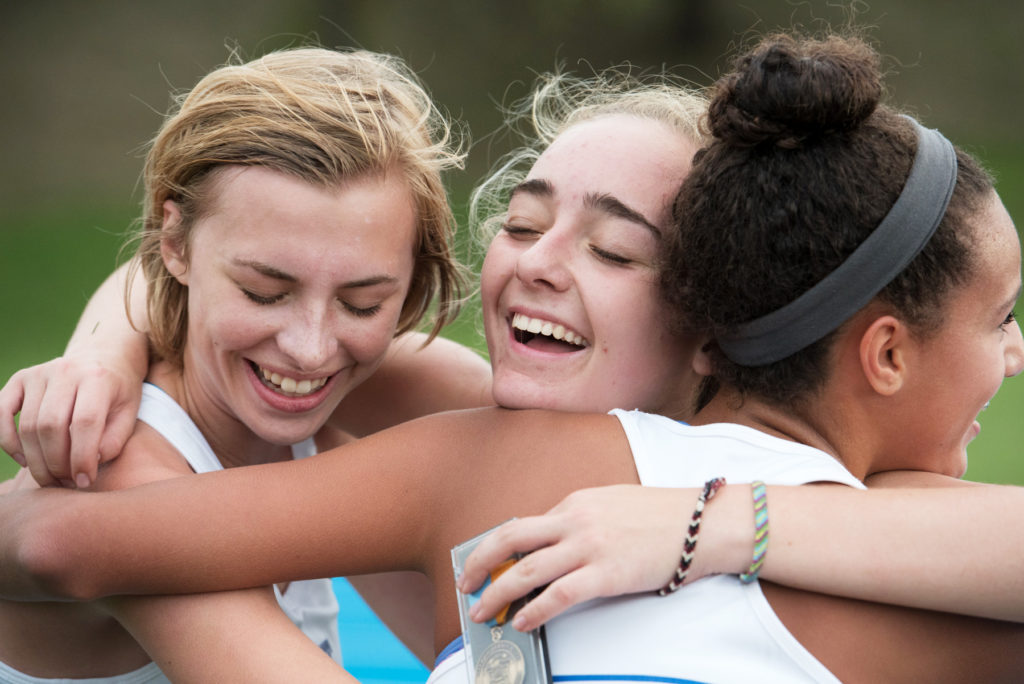 St. Dominic girls varsity runners celebrate at the finish line during the Jersey City Cross Country Championship at Lincoln Park on Thursday, Oct. 13, 2016. Reena Rose Sibayan | The Jersey Journal