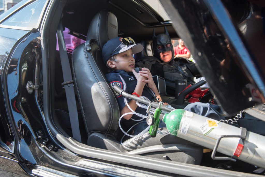 More than 100 police officers, firefighters, and EMTs surprised 9-year-old Parth Patel, who is diagnosed with cancer, with a hero-themed parade from his house on Nelson Street to School 27 on North Street in Jersey City on Wednesday, Oct. 19, 2016, followed by a pizza party in the auditorium. Reena Rose Sibayan | The Jersey Journal