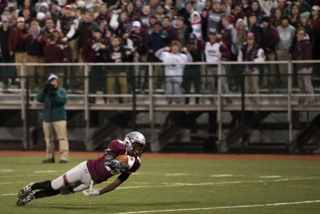 St. Peter's Prep defeats Delbarton, 34-13, during the sectional football opener at Cochrane Field at Caven Point in Jersey City on Friday, Nov. 11, 2016. Here, St. Peter's Zamir Mickens makes a dive for the end zone during the first quarter of the game. Reena Rose Sibayan | The Jersey Journal