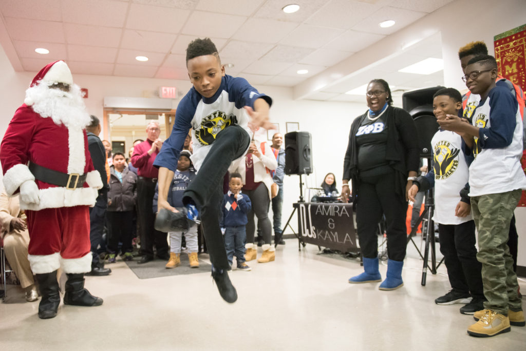 Television personality Wendy Williams and the Hunter Foundation hold a holiday dinner for local families at the Currie Woods Community Center in Jersey City on Wednesday, Dec. 14, 2016. Marco Glorious with "The Wendy Williams Show" emceed the party. Students from Educate the Block at NJCU prepared and served the food, ten-year-old twin sister DJs Amira and Kayla provided the music, and Santa Claus, Mayor Steve Fulop and Freeholder Bill O'Dea helped spread holiday cheer. Reena Rose Sibayan/The Jersey Journal